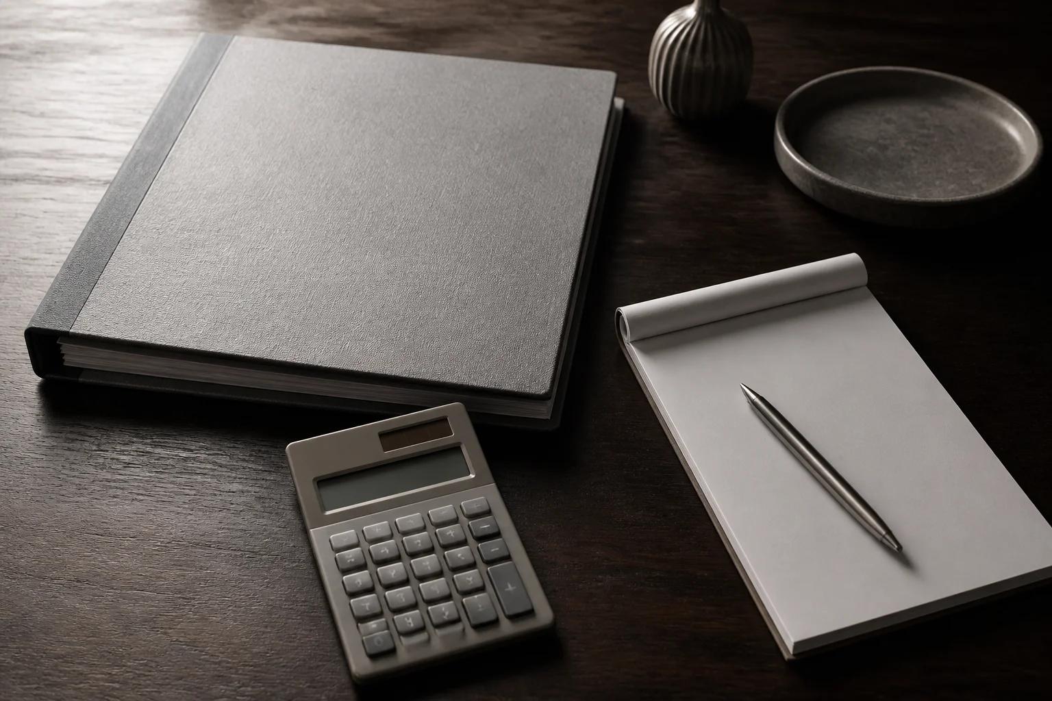 Two unlabeled columns of paper on a zinc desk, the closing table for a buyout
